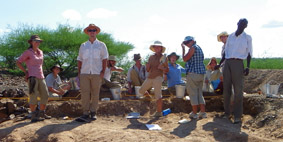 The group at the excavated site of Kokiselei 6.
