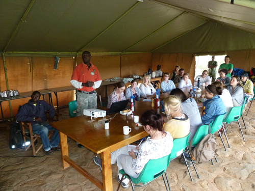Steven Ekwanga talks to the students about lion conservation