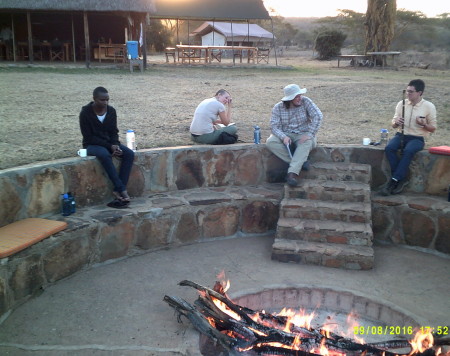 Ken, Meredith, Tristan, and Taylor relax by the fire for the evening.