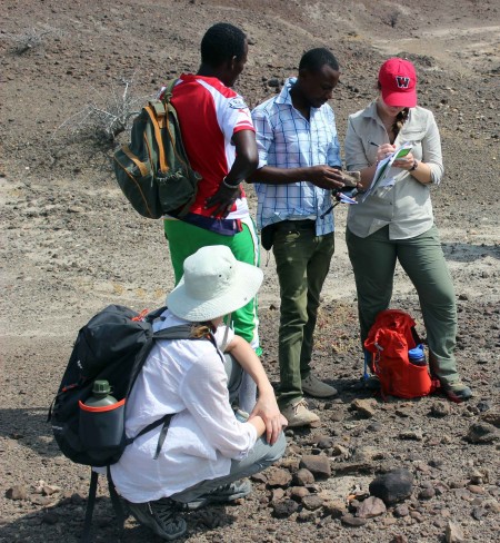 Martin instructs Jen and Milena how to systematically record a fossil find.
