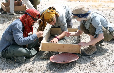 Students pick through what is left over in the sieve to find smaller fragments of fossils that were missed on the first pass.