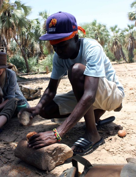 John Ekusi demonstrates the palm nut processing.