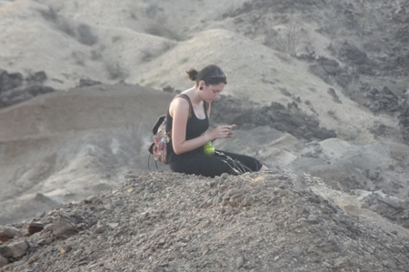 GEO303 - Catherine examines the composition of surface rocks at Turkwel.
