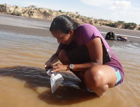 GEO303 – Vaishnavi samples sediment from the Turkwel River.