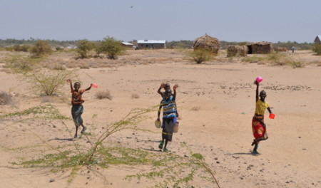 Turkana children waving as we pass through a village