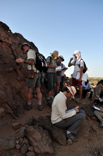 The students stop in the shade of an old fault-line.
