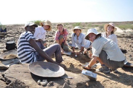 Abdi, Robyn, Kailie, Angela, Erica and Sarah pose for a picture as the excavate the bone.