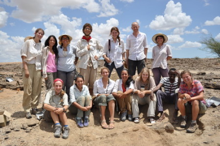 At the end of the morning the students pose for a photo with the excavated bone at the bottom.