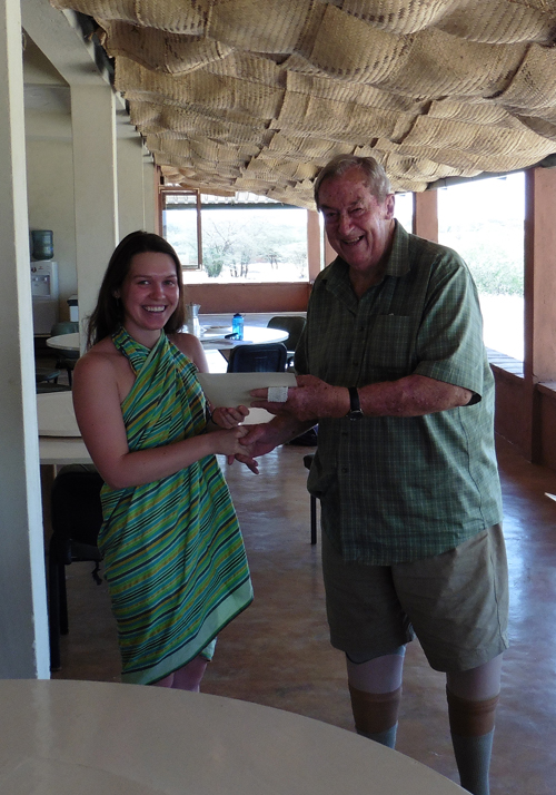 Alex receives her certificate from Dr Leakey
