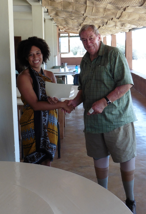 Melina being congratulated by Dr Leakey
