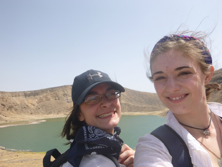 Jayde and Larisa take a selfie in along the crater rim of Flamingo Lake.  Note the flock of flamingos at the shoreline.