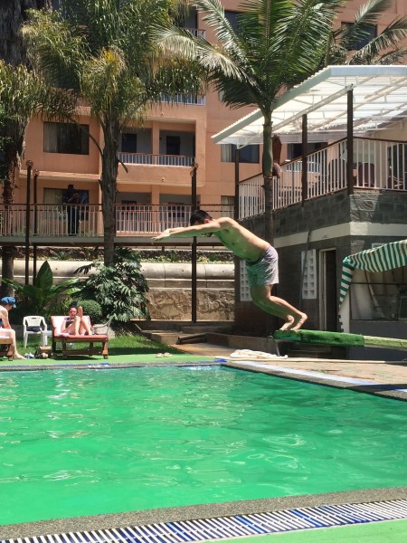 Ryan jumping off the diving board at a hotel pool we visited in town....last time we would be around such luxuries!