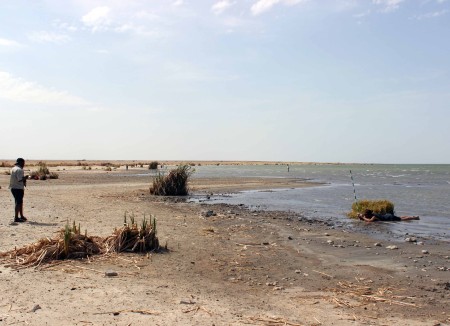 Tadele and Evan collect shoreline elevation data.