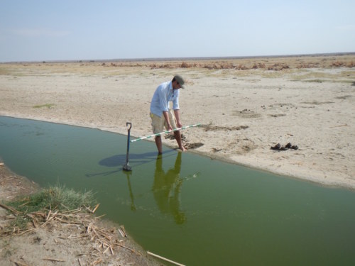 Max using his Jacob staff to measure the lagoon