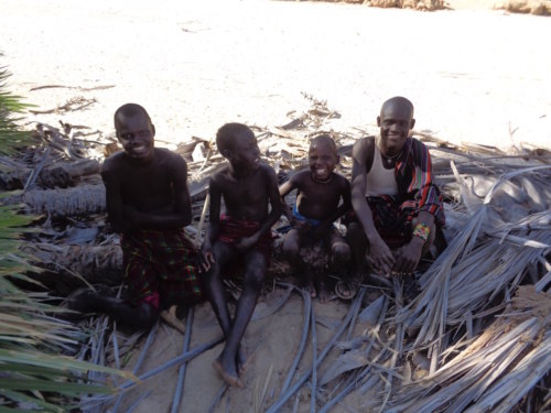 Local Turkana watch the students hard at work