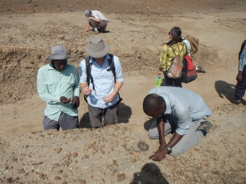 Dr. Skinner and Sale discuss the trench as the students examine the area.