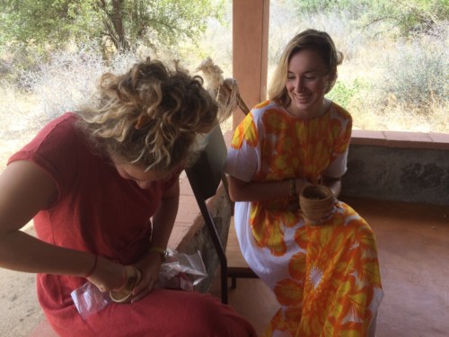 Kathryn and Danielle are having a blast trying to mash ginger in the mortar and pestle!