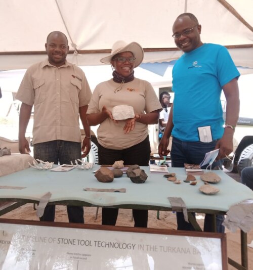 Basil Lewela and Evelyn Apondi with journalist Alex Chamwada at the TBI booth during the 2021 Tobong'u Lore Festival