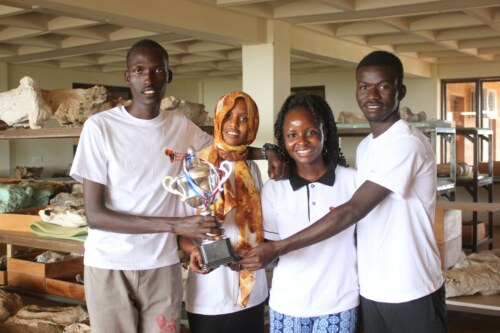 Joseph Arcoy Hirbanle (Left), Rahma Ahmed Said (2nd Left) and James Loki Abucha (Right) in a photo with TBI's Community Development Manager, Joanne Velo (2nd Right)